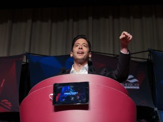 Daily Wire host Michael Knowles speaking at a podium